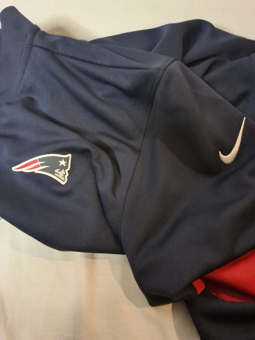 Nike Men’s Patriots 1/4 Zip with White Swoosh and Red Accent